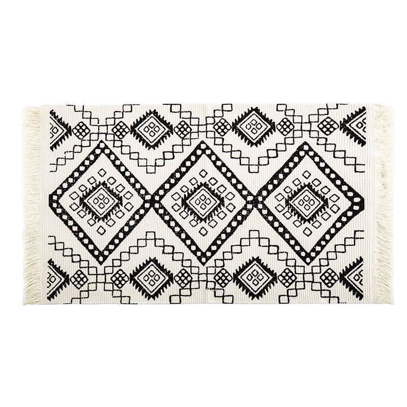 Flat-woven runner rug in ethnic stripe design with hand-fringed edge