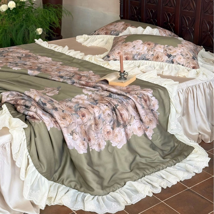 Vintage-inspired satin bedding with elaborate ruffled flounces and rose embroidery