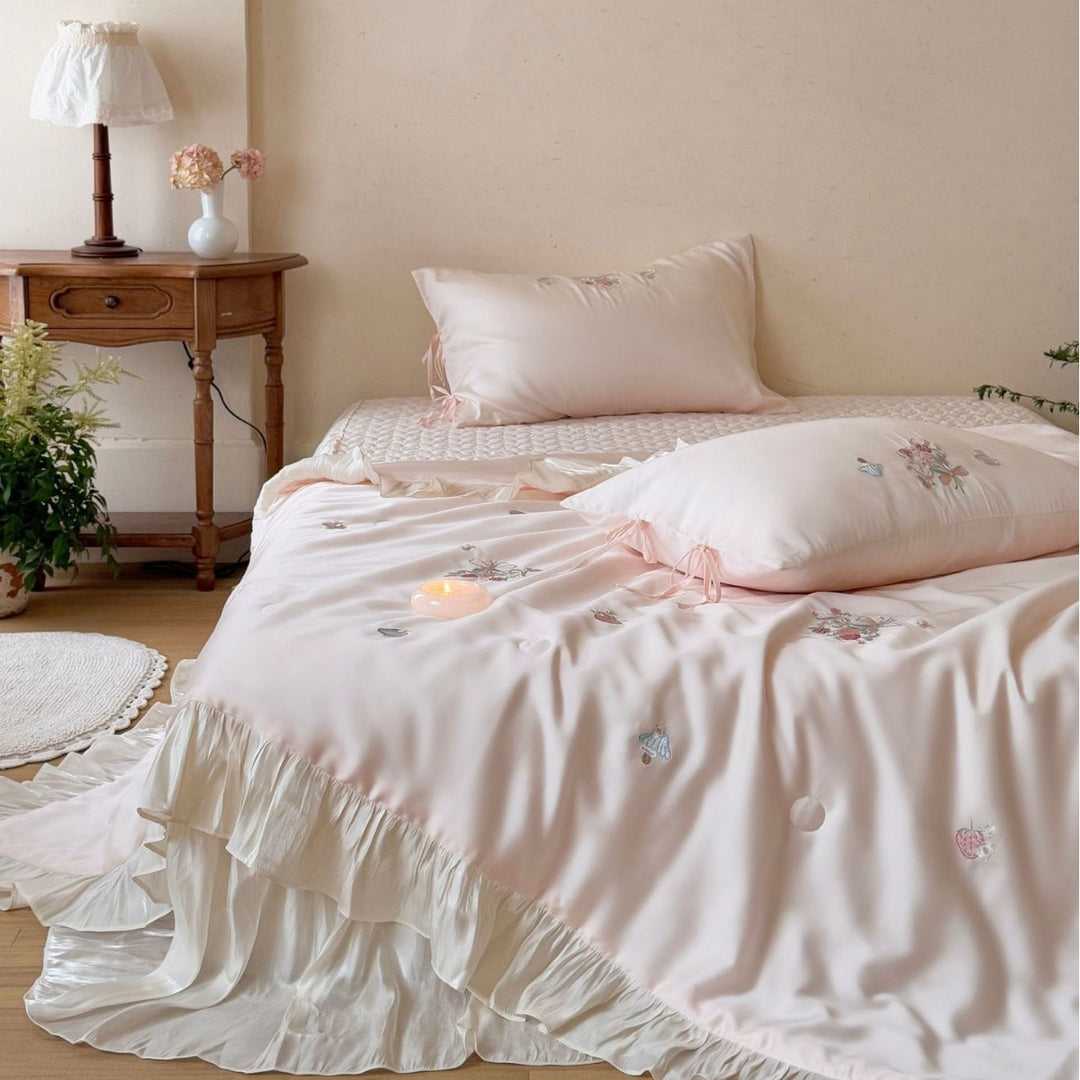 Romantic satin bedding set with ruffle, floral embroidery and tie pillow