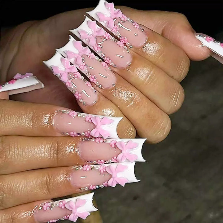 Nail set with elegant 3D flower and pearl decorations Stornfield