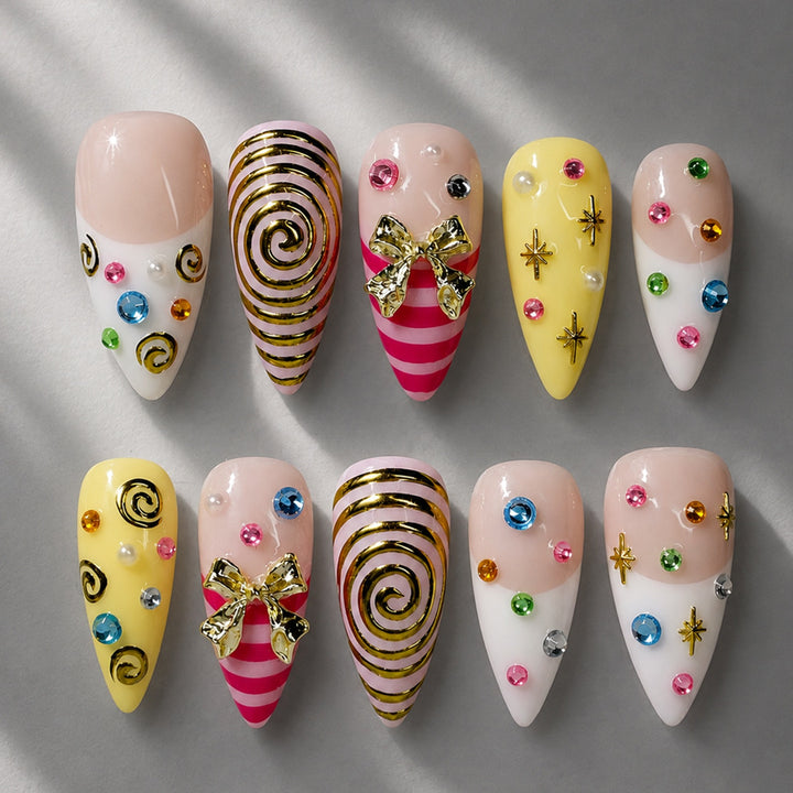 Glamorous artificial nail set with playful designs and sparkling accents Stornfield