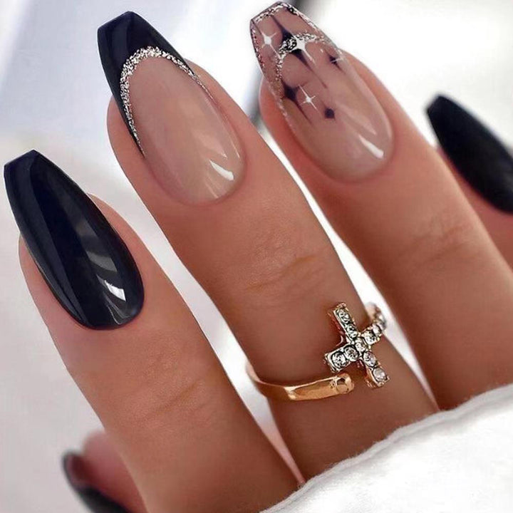 Elegant and artistic stiletto artificial nails with glitter embellishments Stornfield
