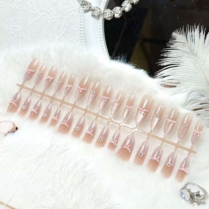Artificial nails with elegant glitter and bow design Stornfield