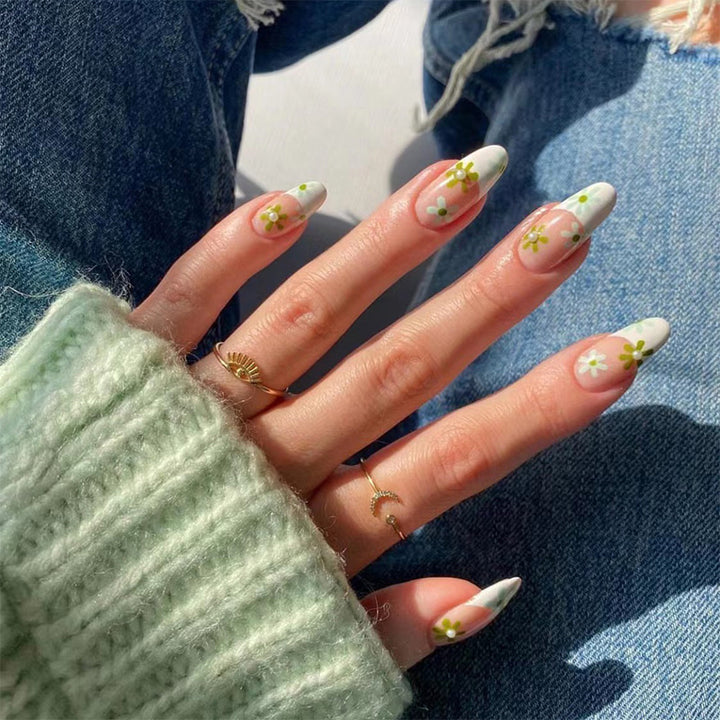 Artful nail art with delicate floral motifs Stornfield