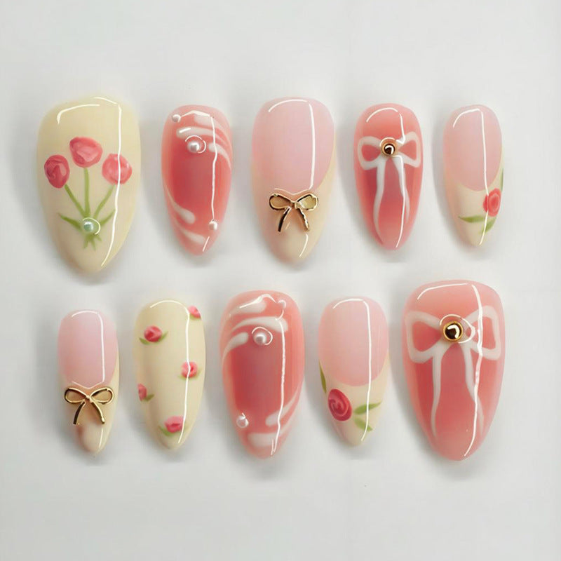 Artificial nail set with floral accents and elegant glitter Stornfield