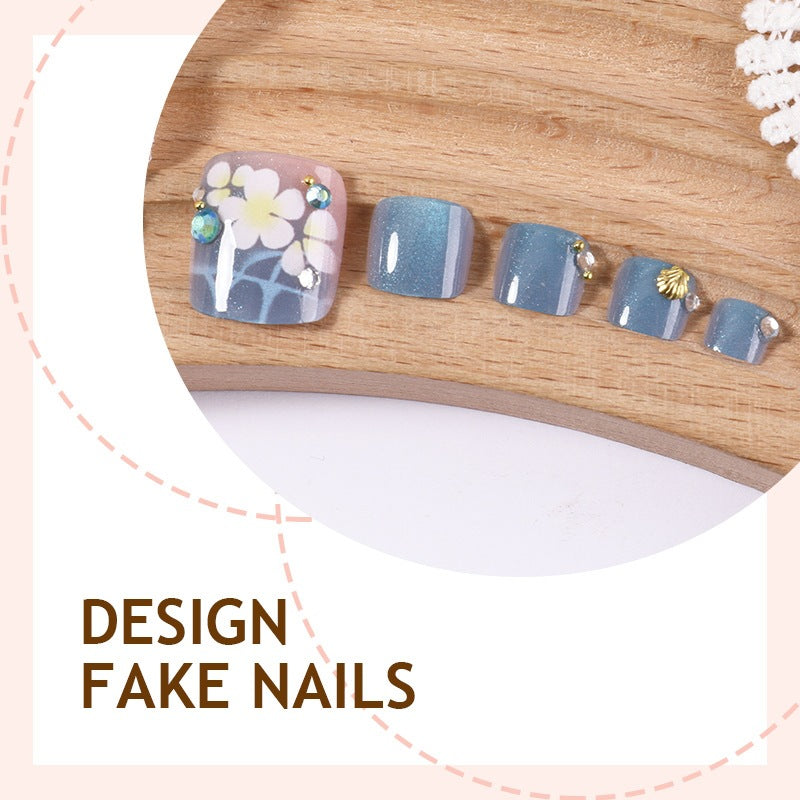 Artificial nail set with floral appliqués and glitter effects Stornfield
