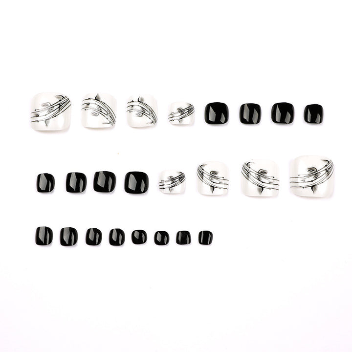 Artful toenail art in elegant black and white design Stornfield
