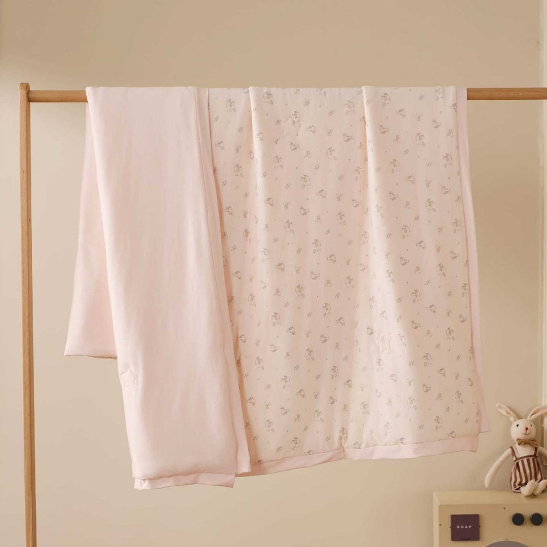 Double-layer baby crawling blanket made of cotton jersey with light padding and delicate all-over animal print