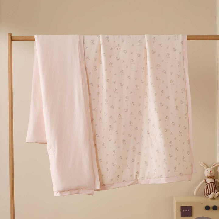Double-layer baby crawling blanket made of cotton jersey with light padding and delicate all-over animal print
