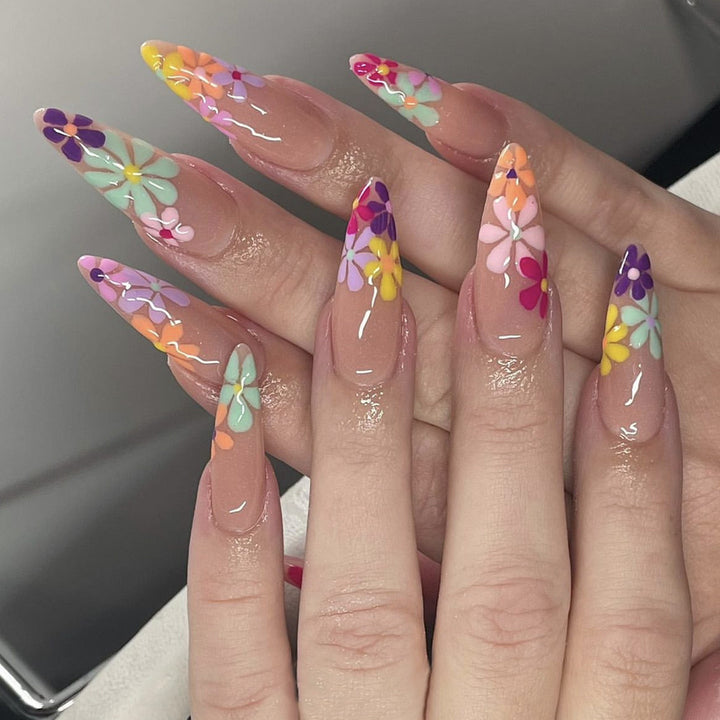 Acrylic nail set with vibrant floral designs and sharp accents Stornfield