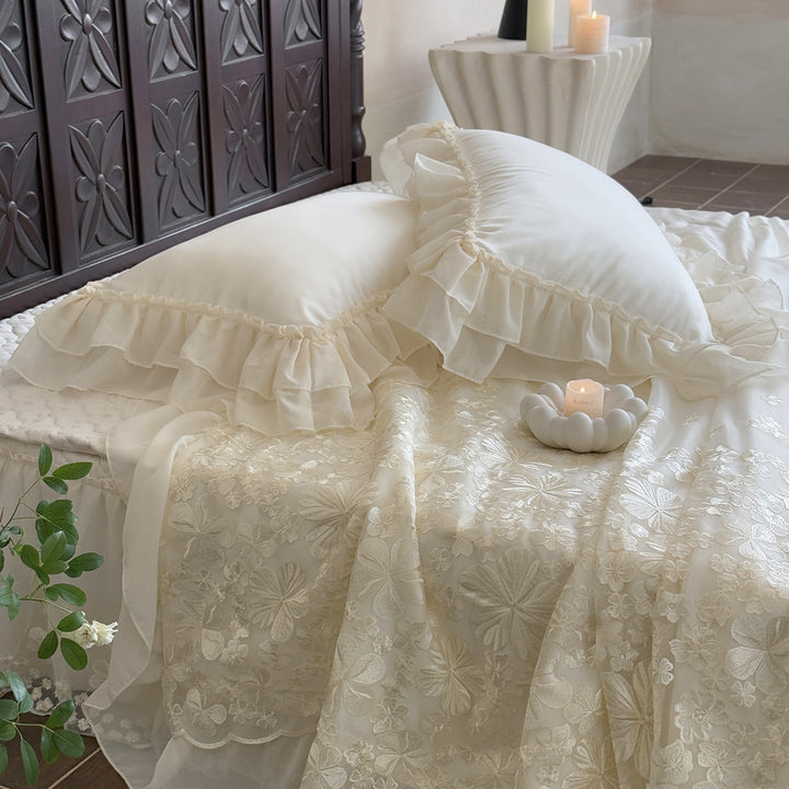 Elegant satin bedding set with double-layer chiffon ruffle and floral relief embroidery