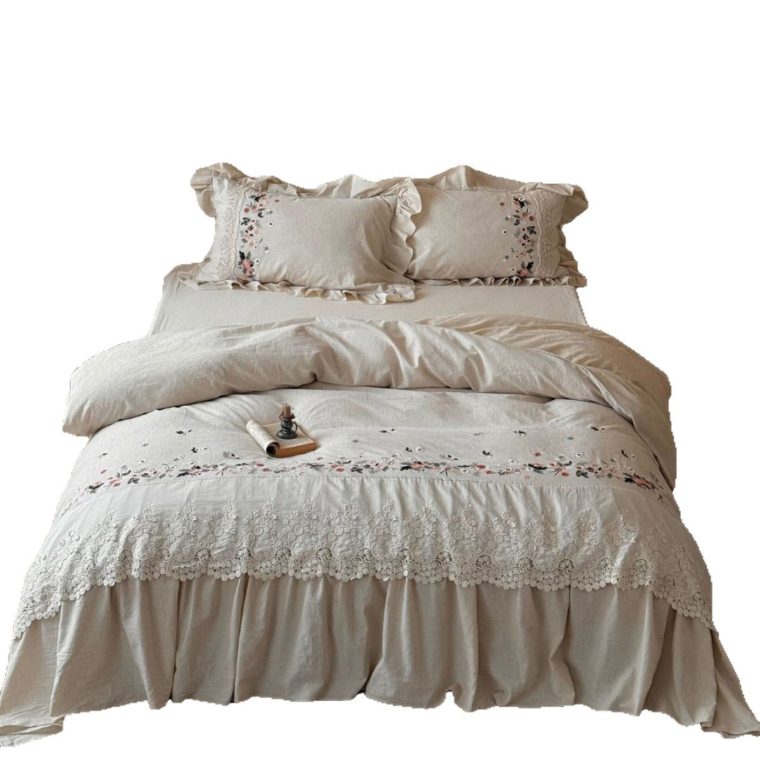 Romantic bedding set in country house style with embroidered border, frill and lace appliqué