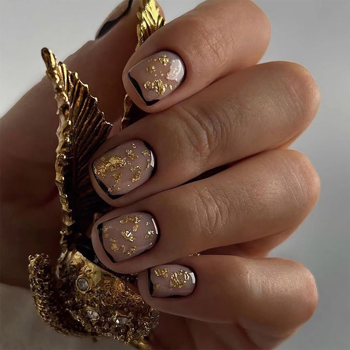 Artificial nail set with delicate gold accents and elegant finish Stornfield