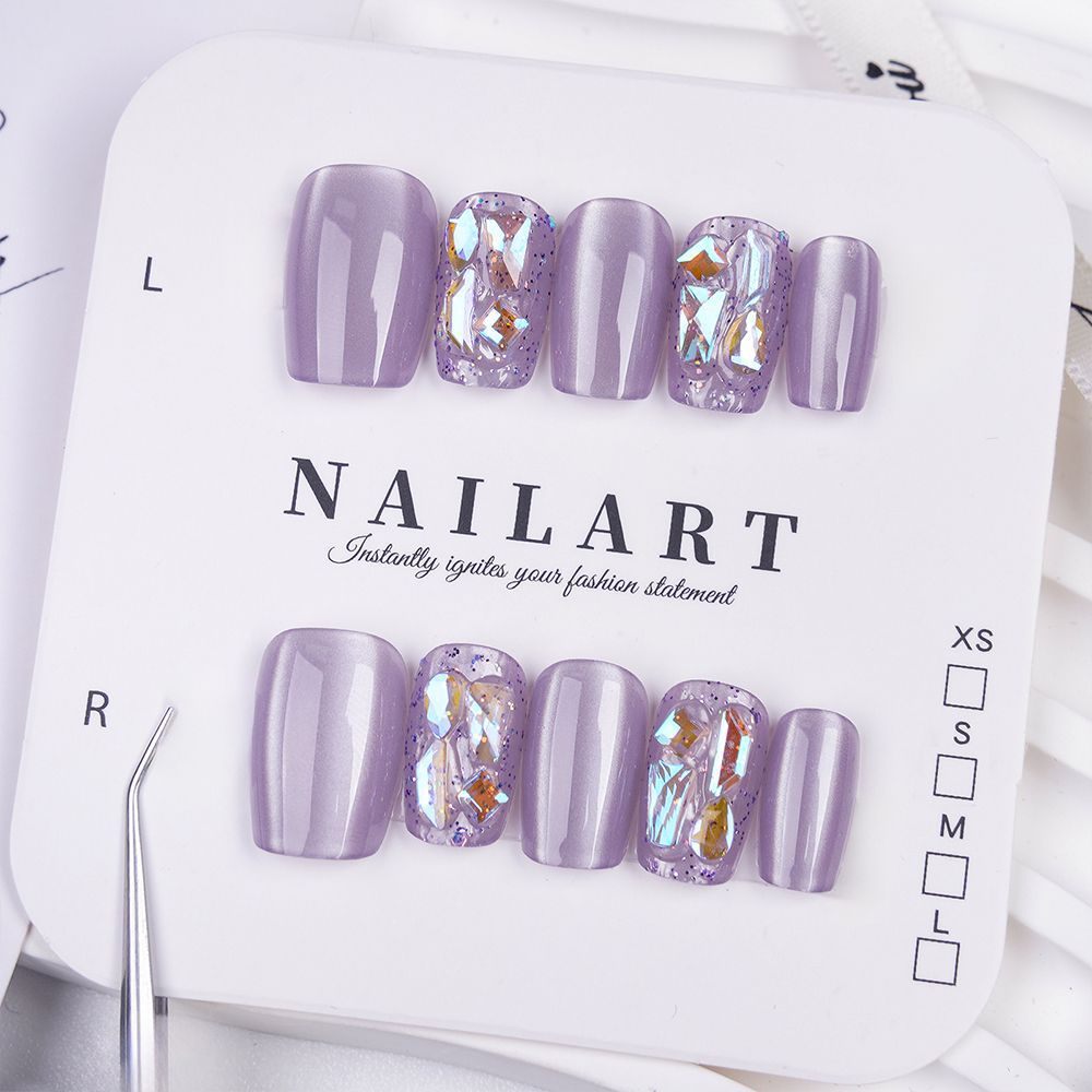 Acrylic nails with glitter accents and modern designs Stornfield