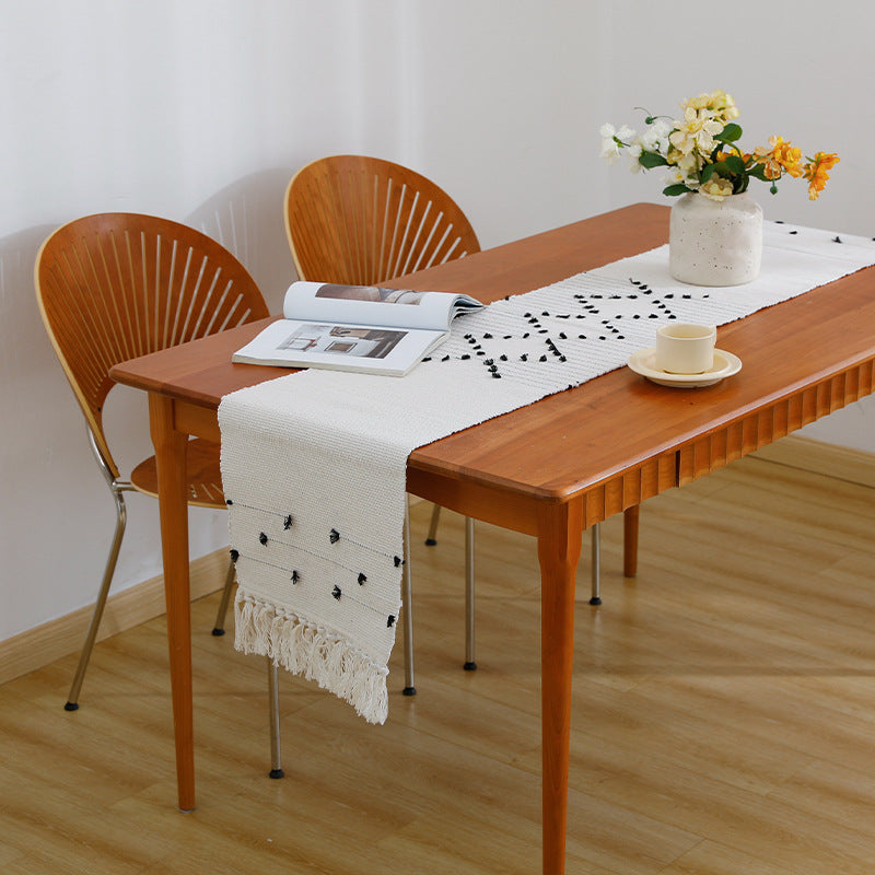 Decorative web runner for dining table with hand-tufted dots and fringes
