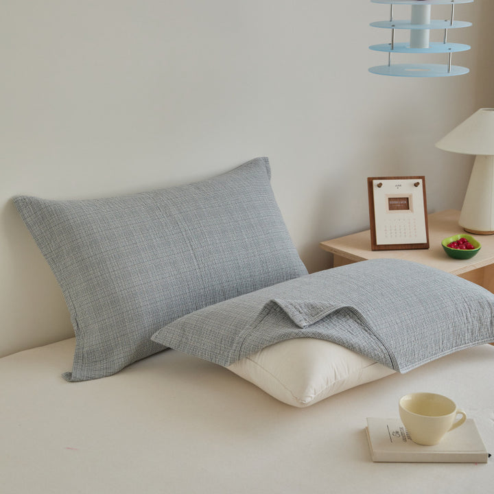 Textured cushion cover set made of cotton-linen blend with waffle structure