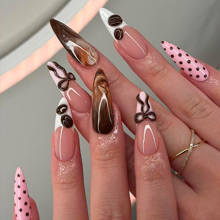 Elegant artificial nails with chocolate motifs and 3D elements Stornfield