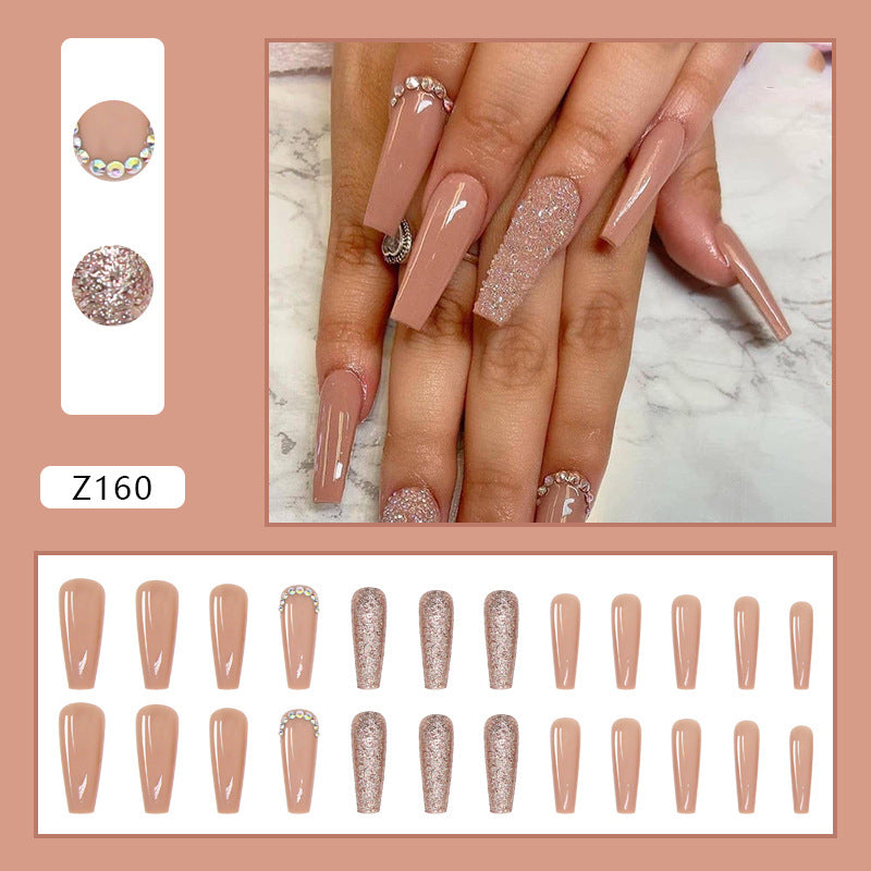 Glamorous artificial nail extensions with rhinestone and glitter details Stornfield