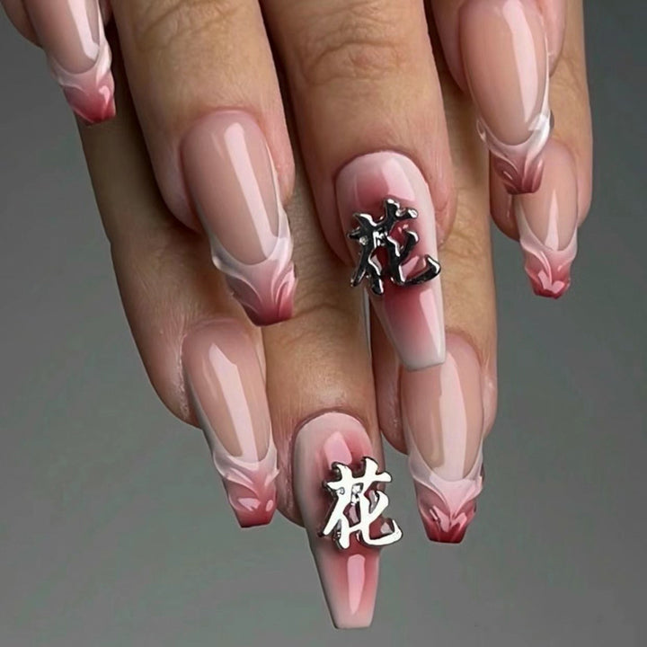 Artful stiletto nails with floral accents and 3D details Stornfield