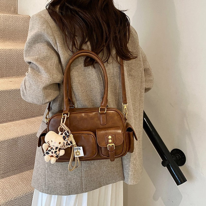 Elegant Handbag with Playful Charms and Multiple Compartments Stornfield