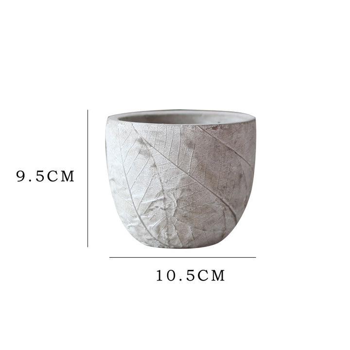 Decorative plant container made of handmade ceramic with leaf pattern Stornfield