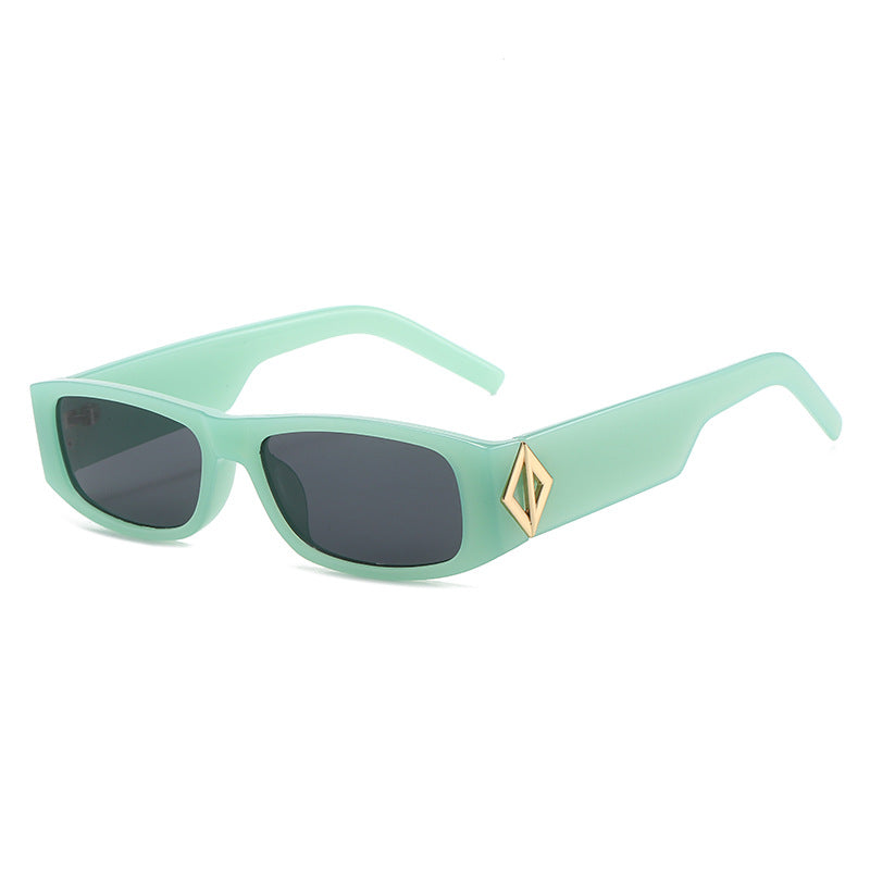 Ladies fashionable sunglasses with asymmetrical frame and gold-colored details Stornfield