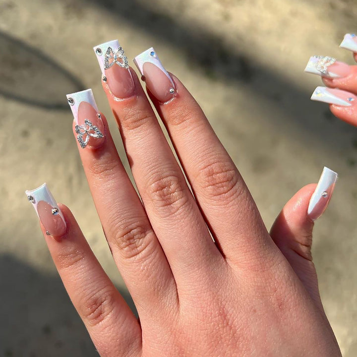 Elegant Nail Art with Glitter and Floral Accents Stornfield