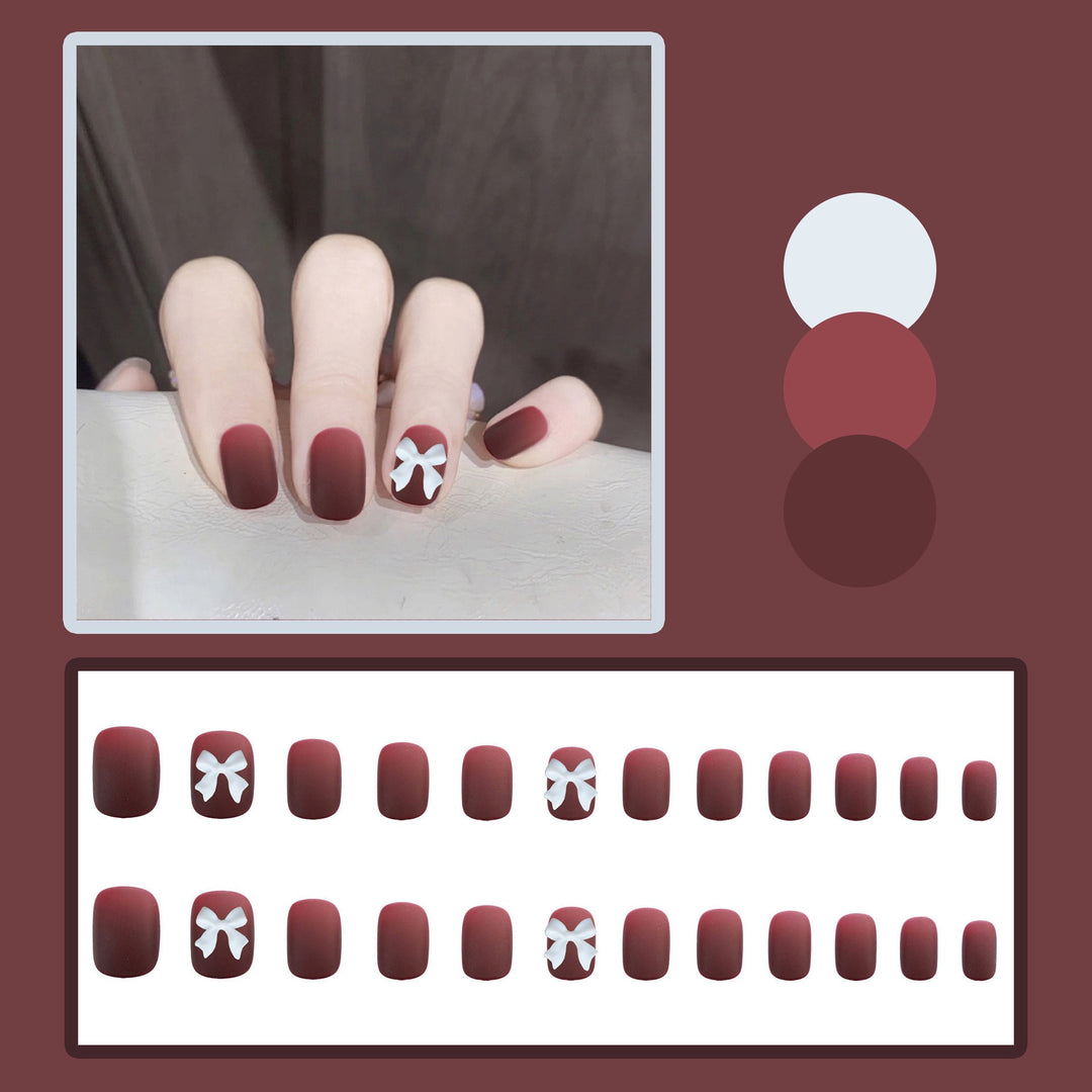 Artificial nails with elegant bow motifs Stornfield