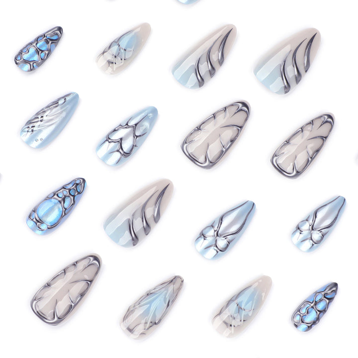 Artful stiletto nails with playful metallic details Stornfield
