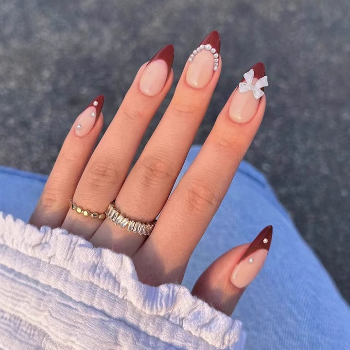 Artificial nail set with glamorous rhinestone and bow decorations Stornfield