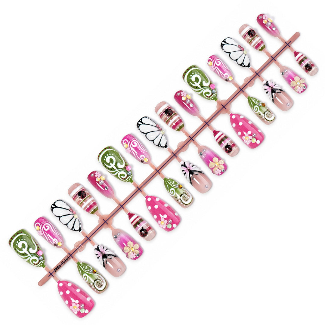 Artificial nail set with playful floral and glitter motifs Stornfield