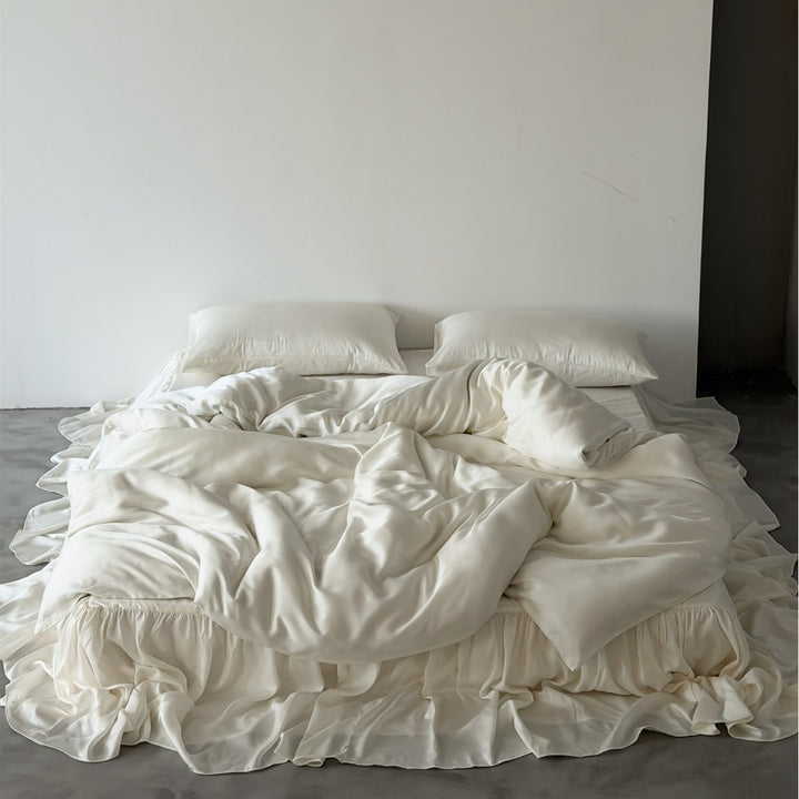 Bedding set with voluminous bed skirt and soft satin finish