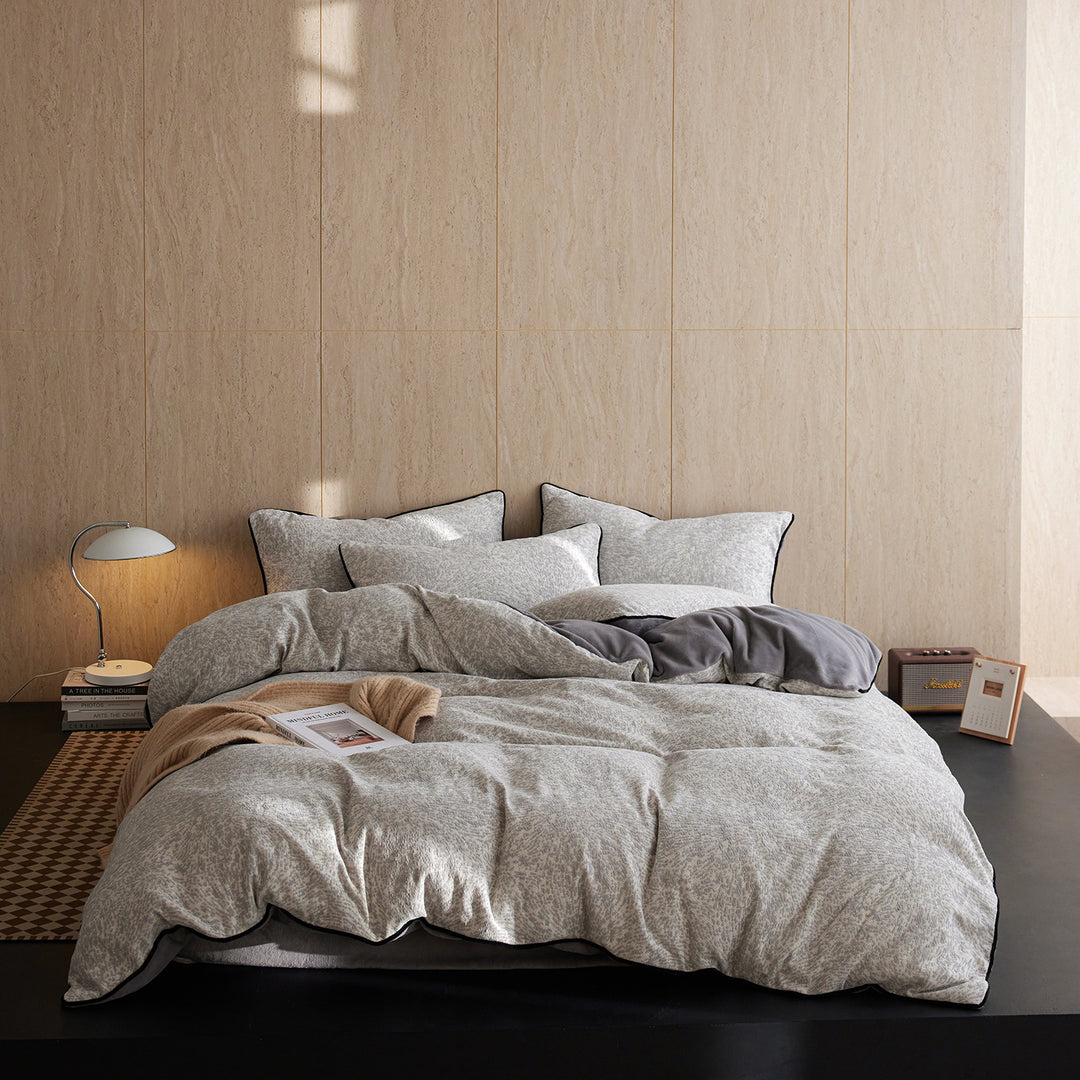 Premium bedding set made of breathable cotton blend with contrast piping