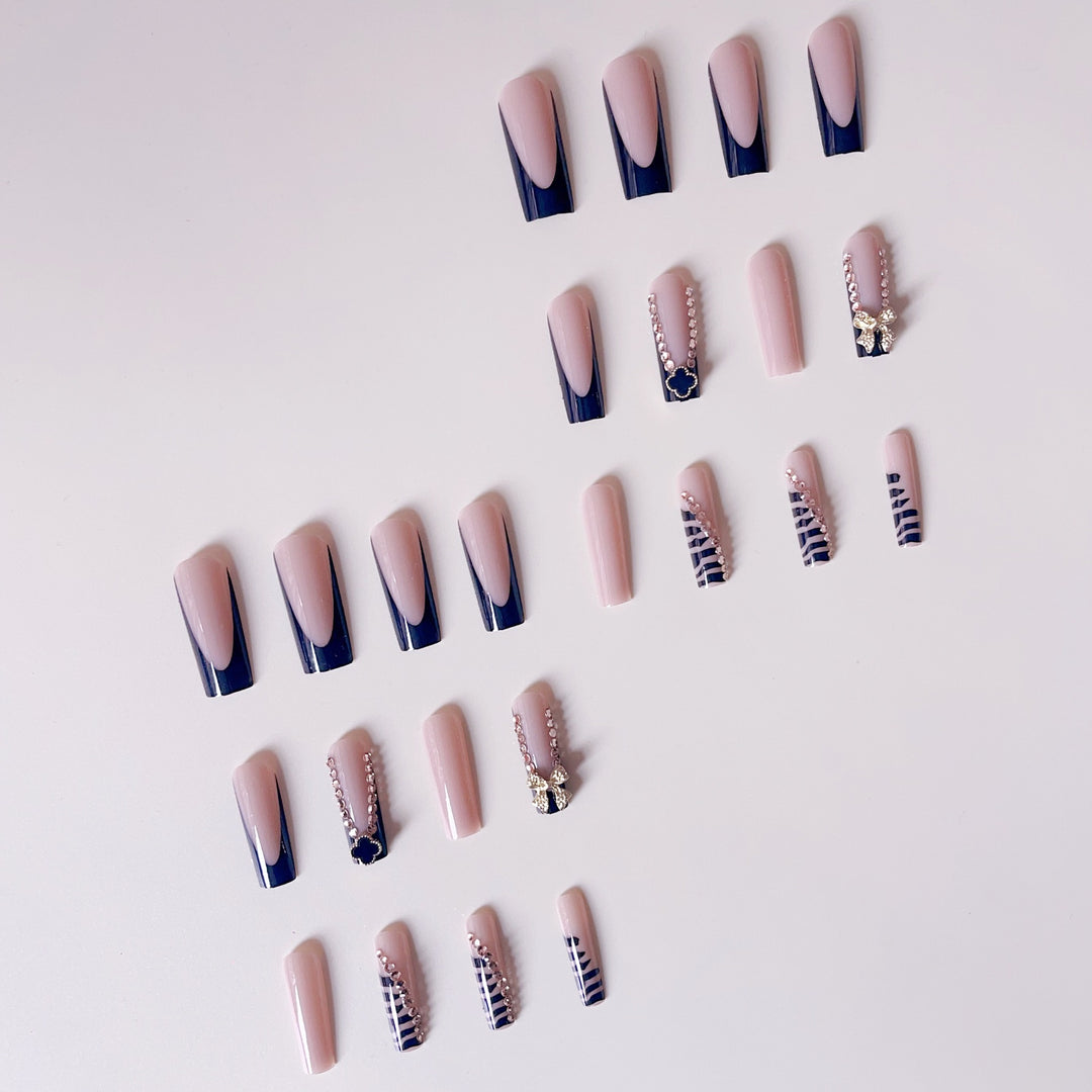 Glamorous artificial nails with elegant design with rhinestones and 3D decorations Stornfield