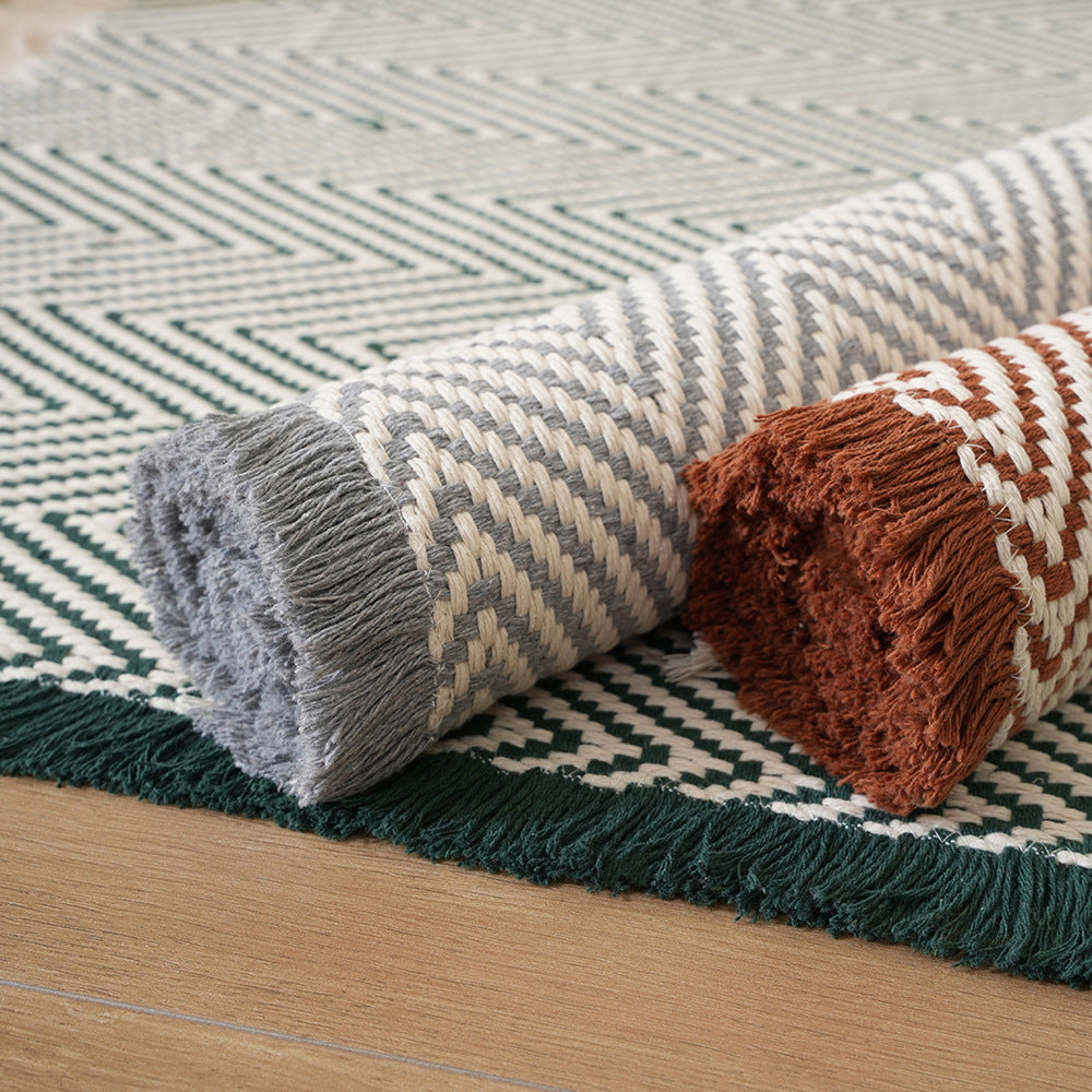 Handwoven cotton bath mat with herringbone pattern and fringes Stornfield