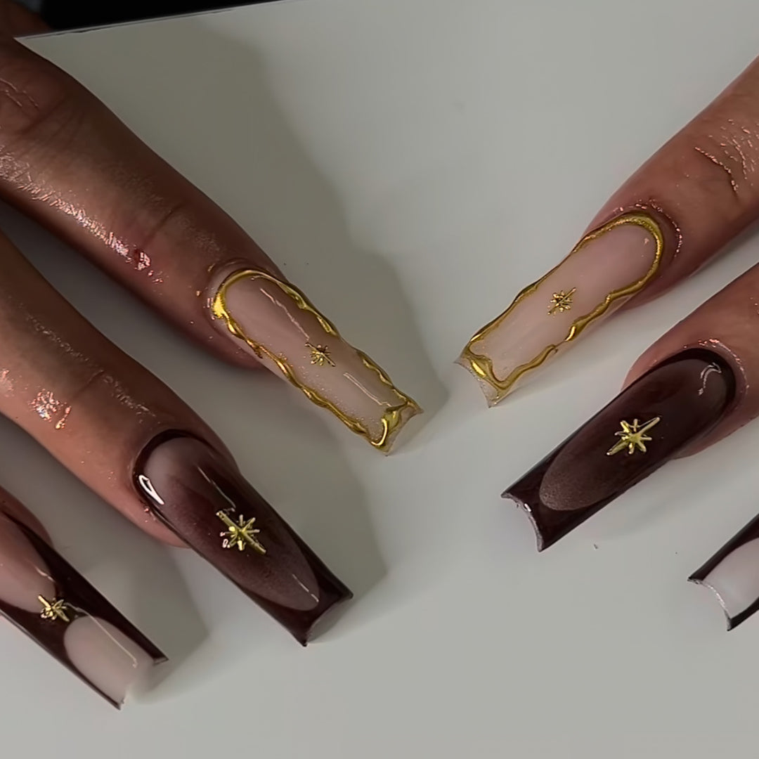 Artistic Long Press-On Nail Art Extensions with Gold Detailing Stornfield