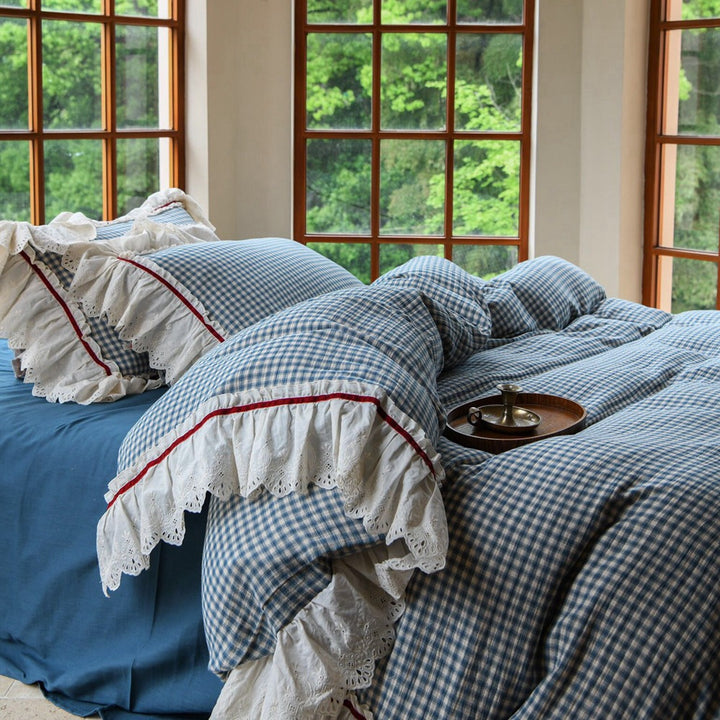 Luxurious bed linen set made of cotton gauze with quilted blanket and lace trim