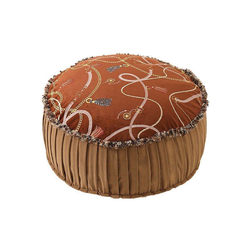 Beef seat pouf with embroidered top, pleated side panel and decorative fringe edge