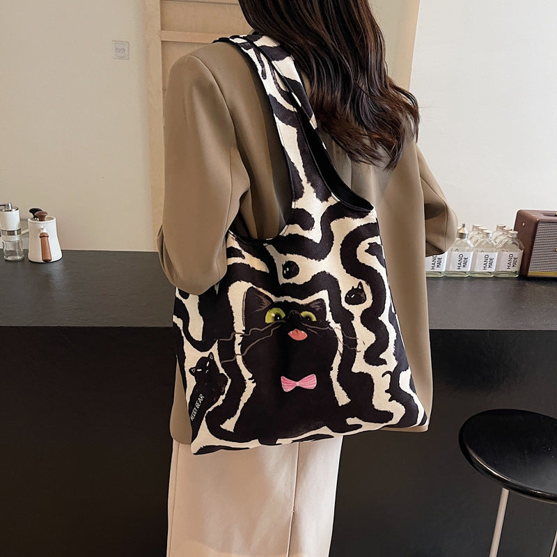 Shoulder bag with playful cat motif Stornfield