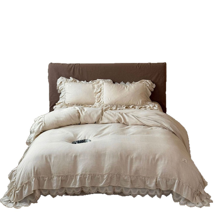 Country house style bed linen set with ruffles, lace border and quilted bedspread