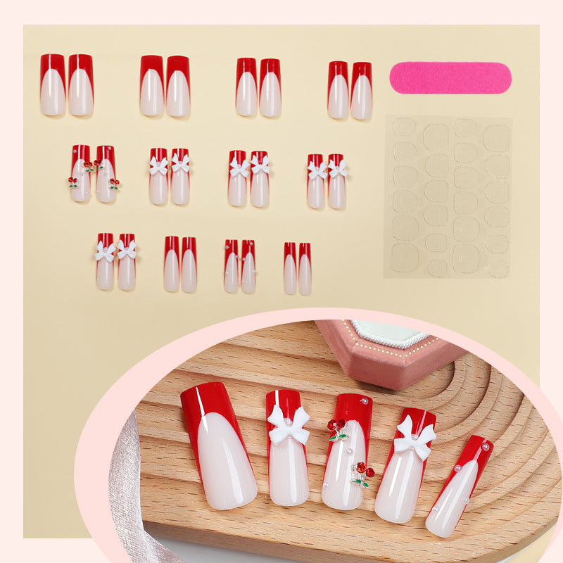 Creative nail set with festive cherry motifs Stornfield