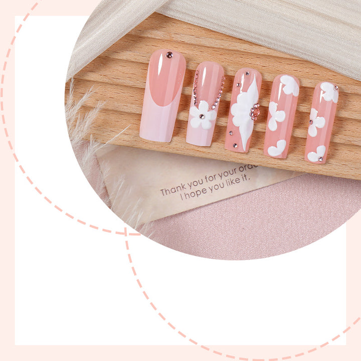 Artificial nail set with delicate flower and glitter details Stornfield