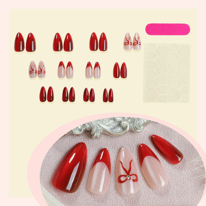 Designer artificial nails with elegant bow decoration Stornfield