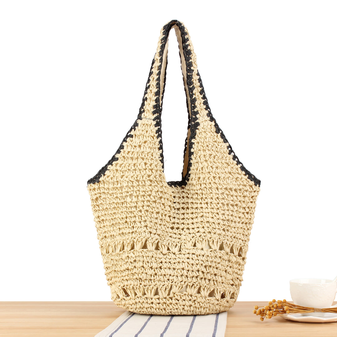 Beach shoulder bag made of handwoven natural material with comfortable carrying handles Stornfield