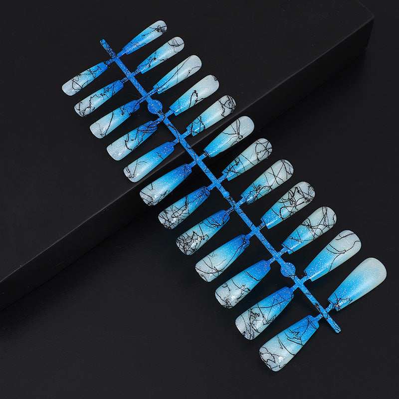 Artificial nails in modern ombre design with marbled accents Stornfield