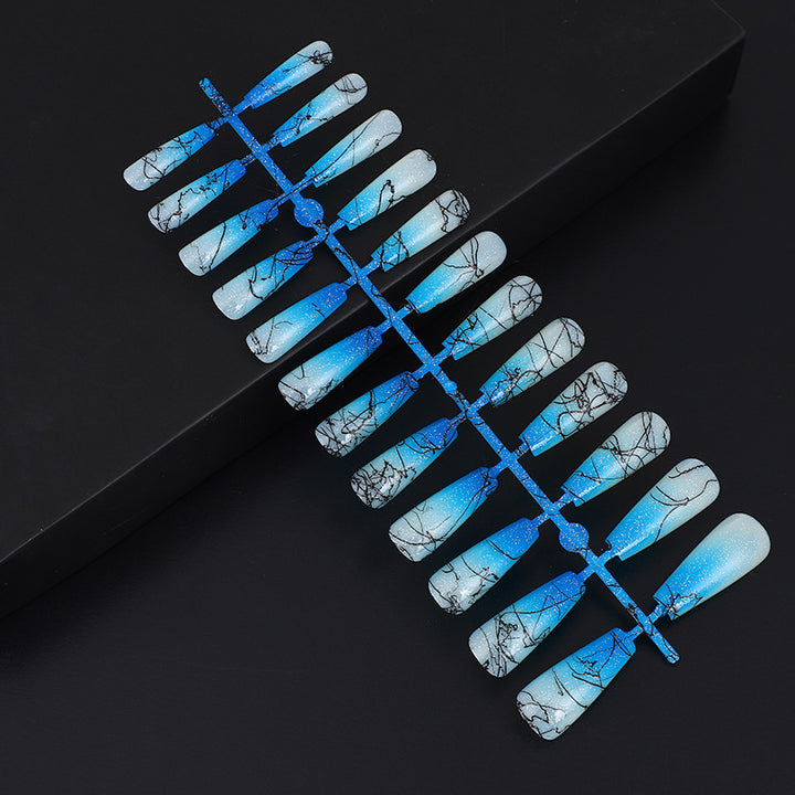 Artificial nails in modern ombre design with marbled accents Stornfield