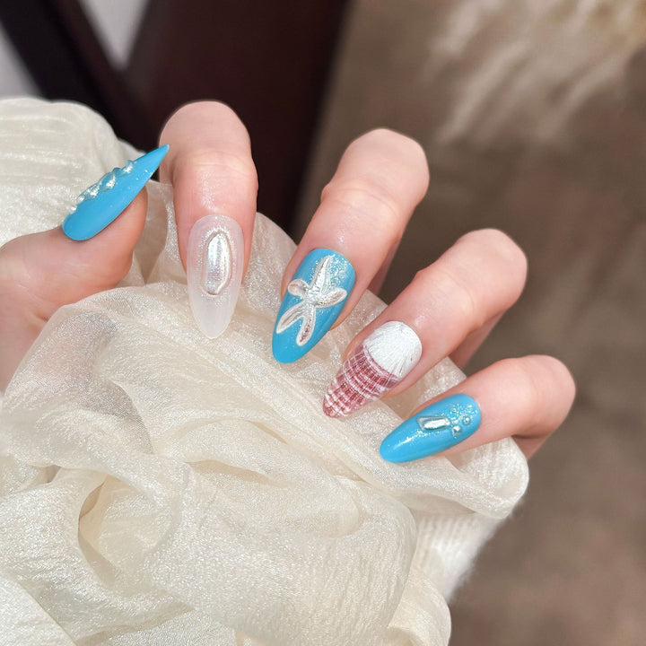 Artistic Press-On Nail Set with Ocean-Themed Designs