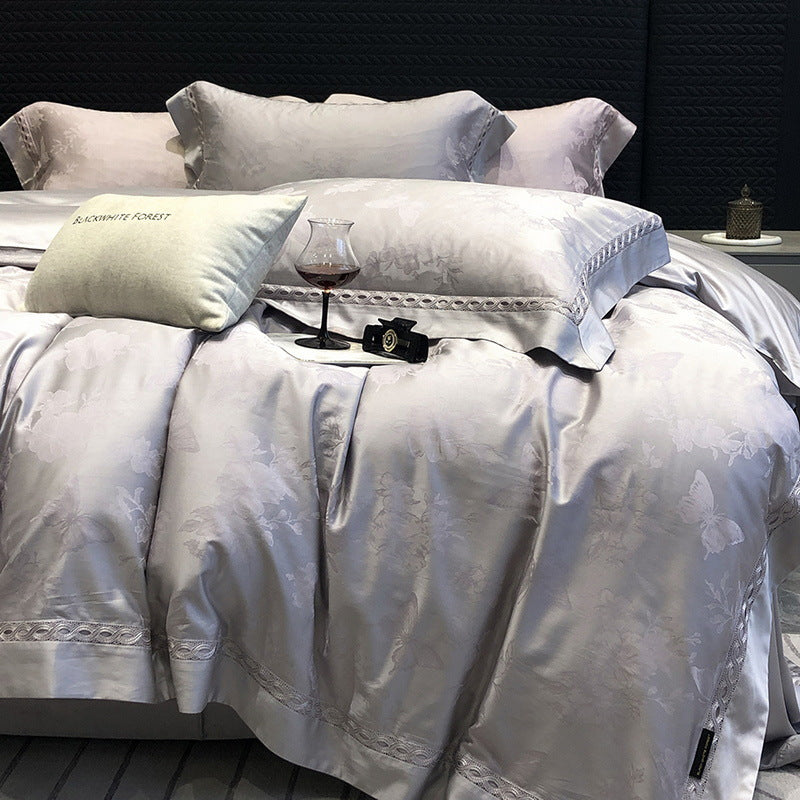 Premium cotton satin bedding set with fine jacquard floral texture and piped border