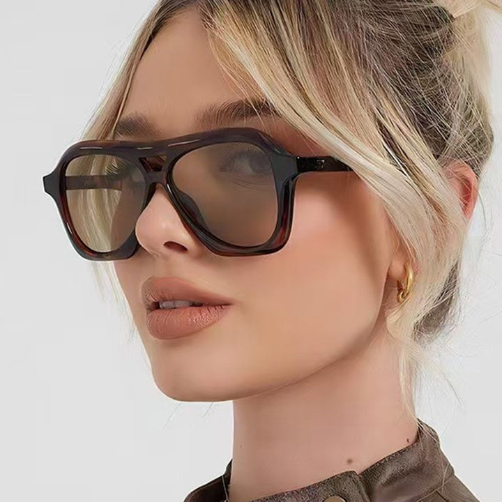 Ladies fashionable sunglasses in innovative design with wide frame Stornfield