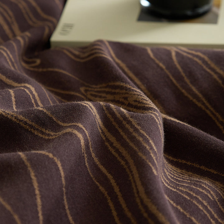 Modern bedding set made of cotton percale with organic stain pattern